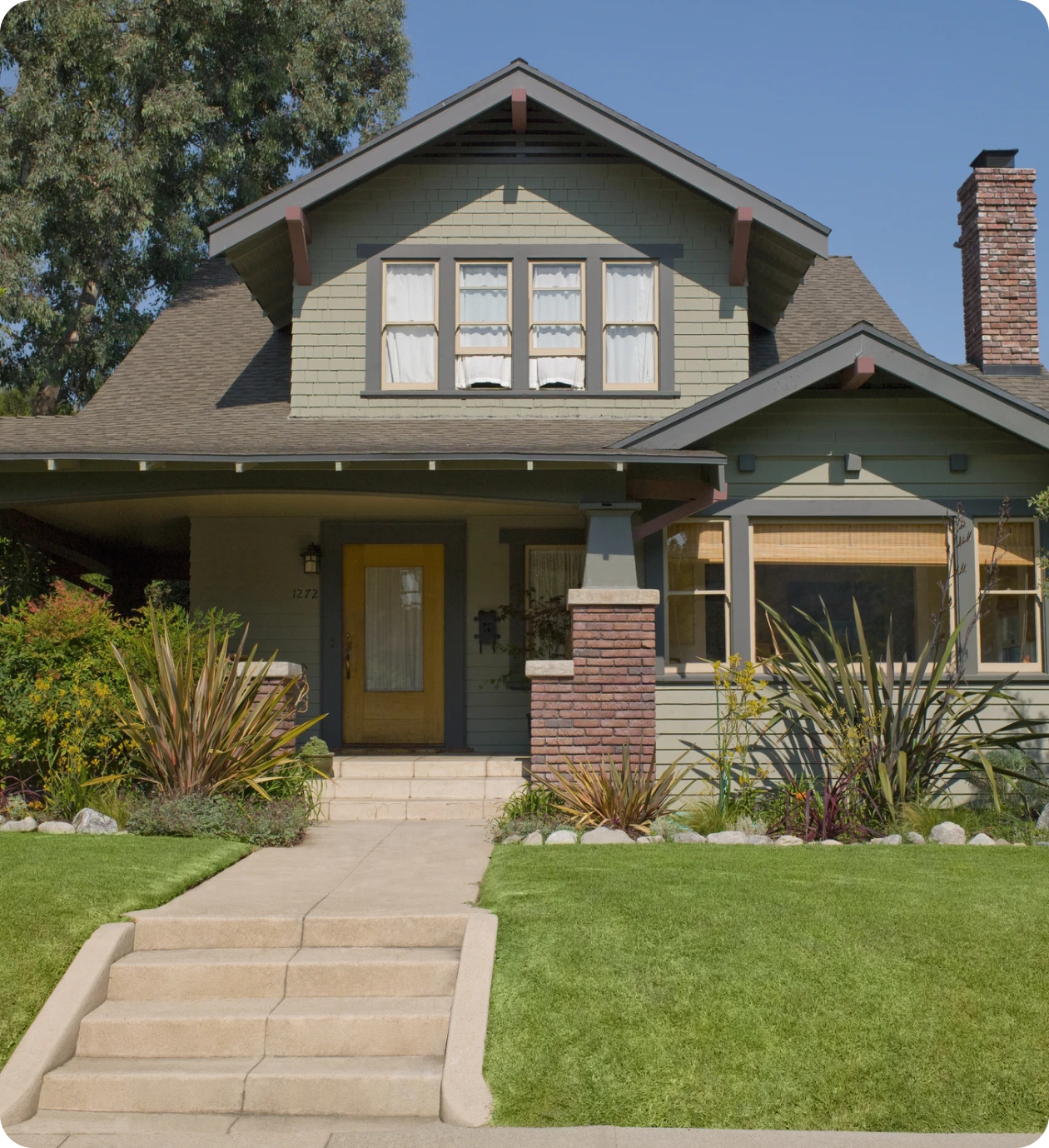 Two-story home with brick accents