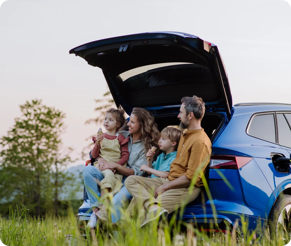 Outdoor family time with SUV backdrop
